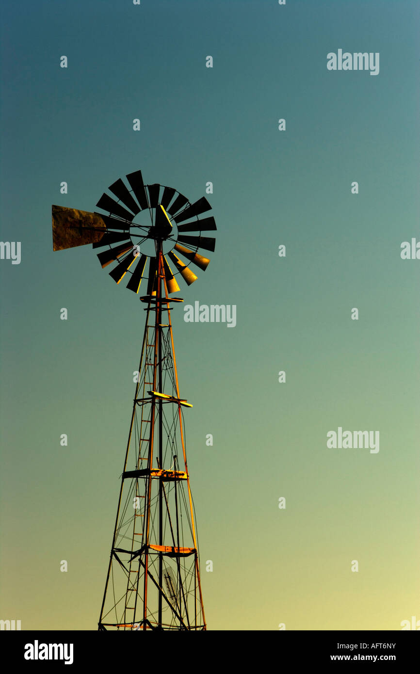 Agricultural windmill at dusk. Stock Photo