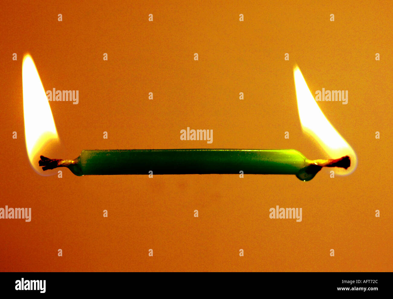 Burning the candle from both ends hires stock photography and images