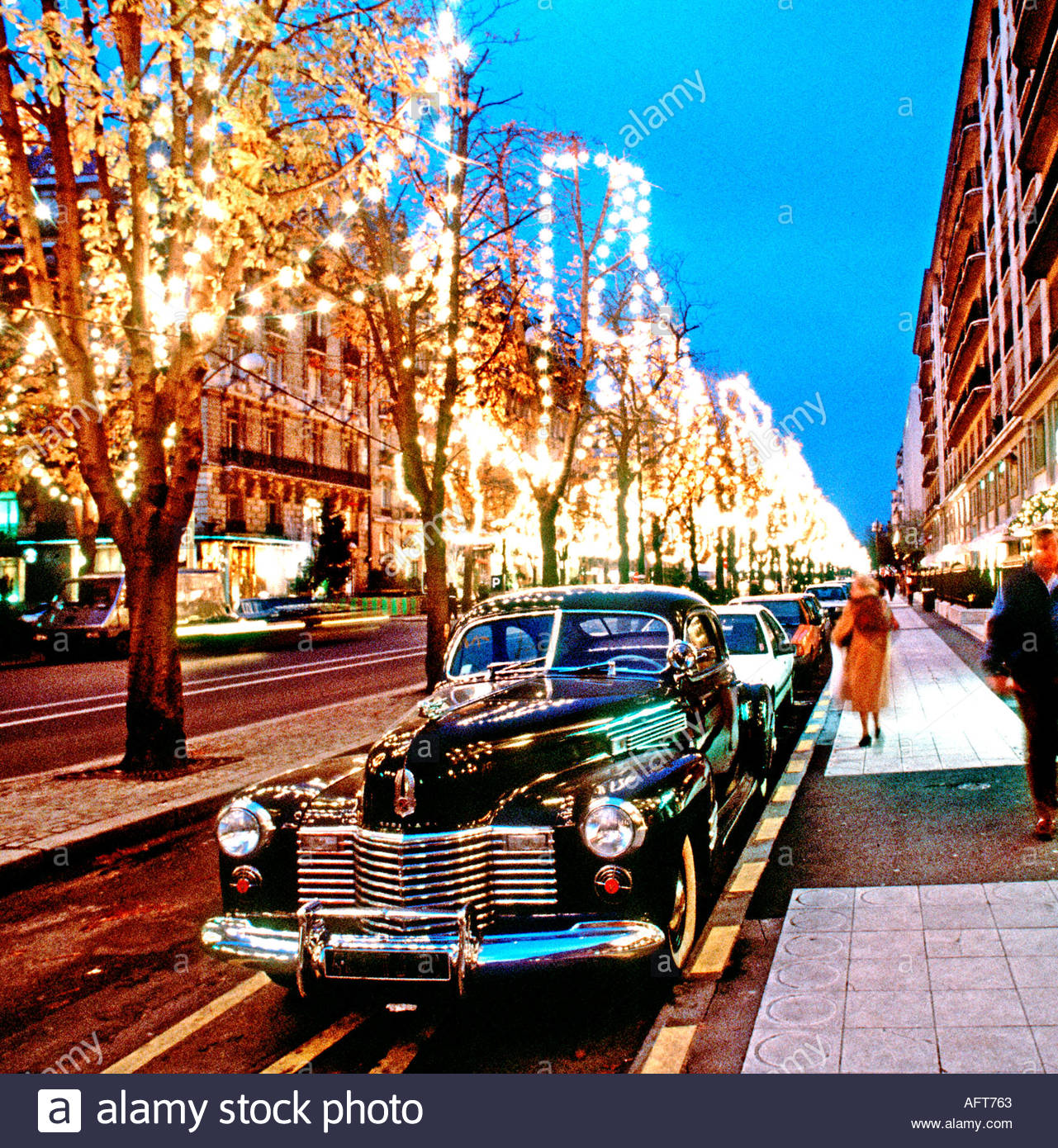 Christmas in Paris France "Ave Montaigne" Winter Street Scene Lit Up at  Night, vintage paris street cars, france electricity wasting Stock Photo -  Alamy