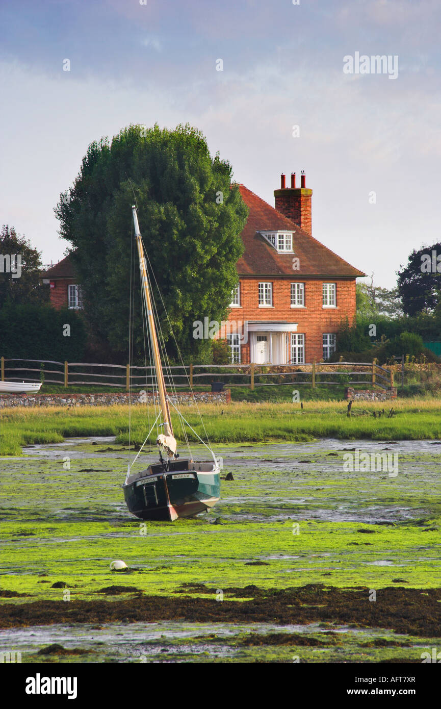 dinghy beached at low tide Bosham Stock Photo
