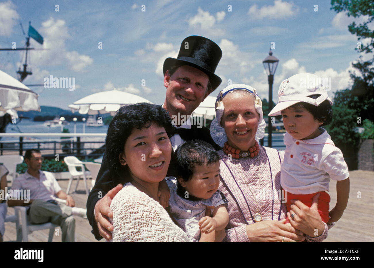 Japan Nagasaki Family smiling Dutch people in traditional dress and local Japanese family in Holland Village Stock Photo