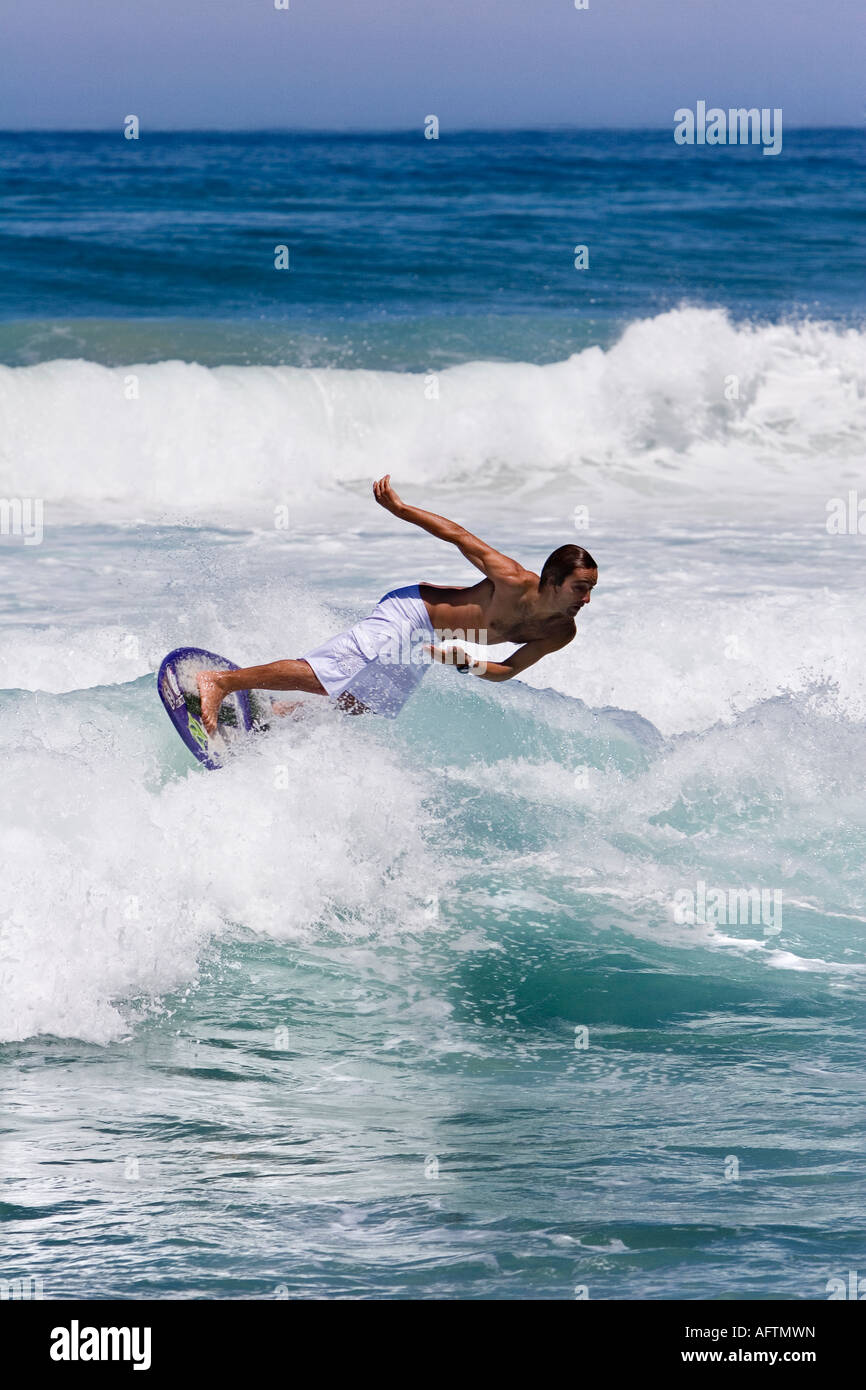 Surfer Surfing On Breaking Wave Using A Skimboard Stock Photo - Alamy