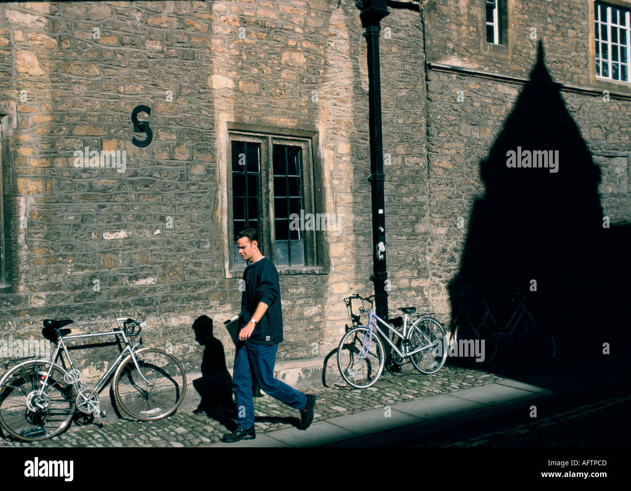 Oxford bikes shadow from Merton college HOMER SYKES Stock Photo Alamy