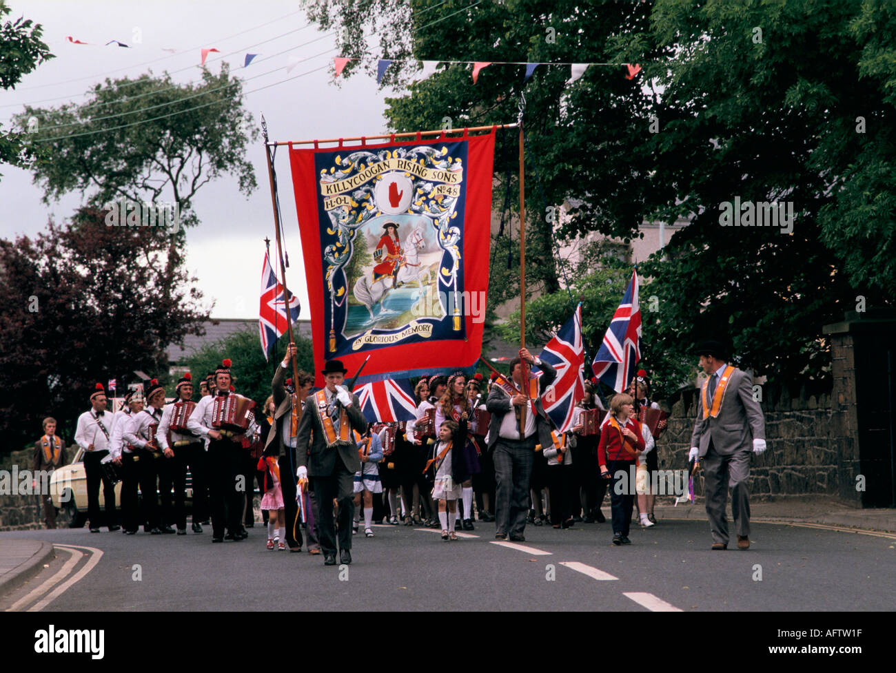 Orange day Parade Killycoogan Co Antrim Killycoogan Rising Sons banner. Northern Ireland  UK 1980s HOMER SYKES Stock Photo