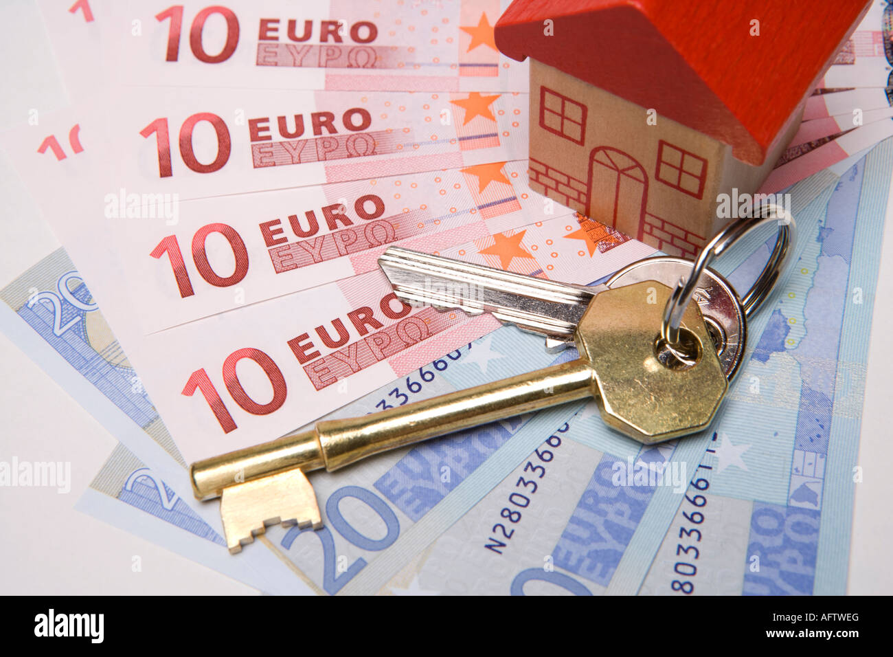 Keys to new house Buying or investing in property or house overseas or abroad with euros Stock Photo