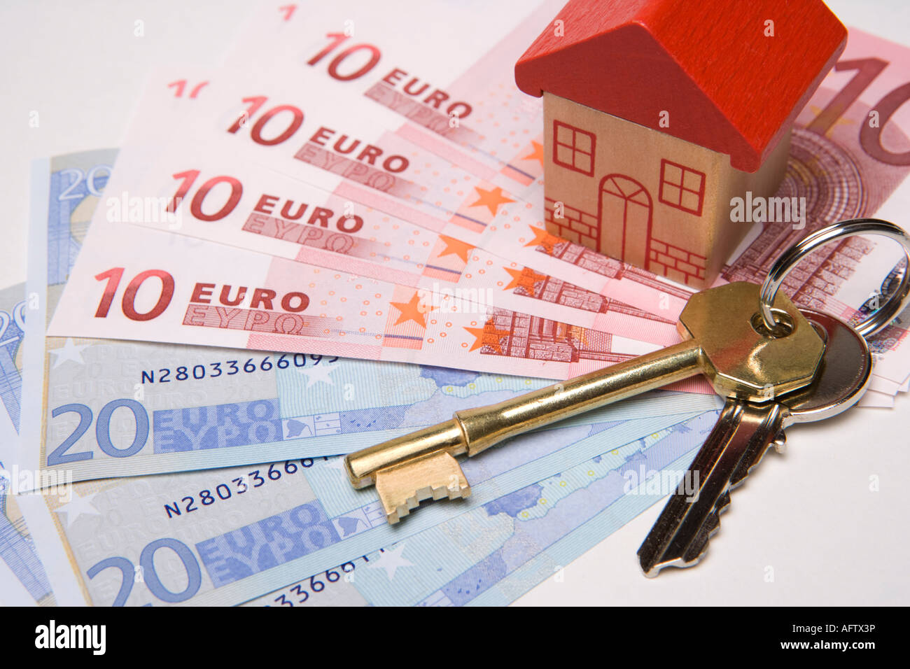 Keys to new house Buying or investing in property or house overseas or abroad with euros Stock Photo