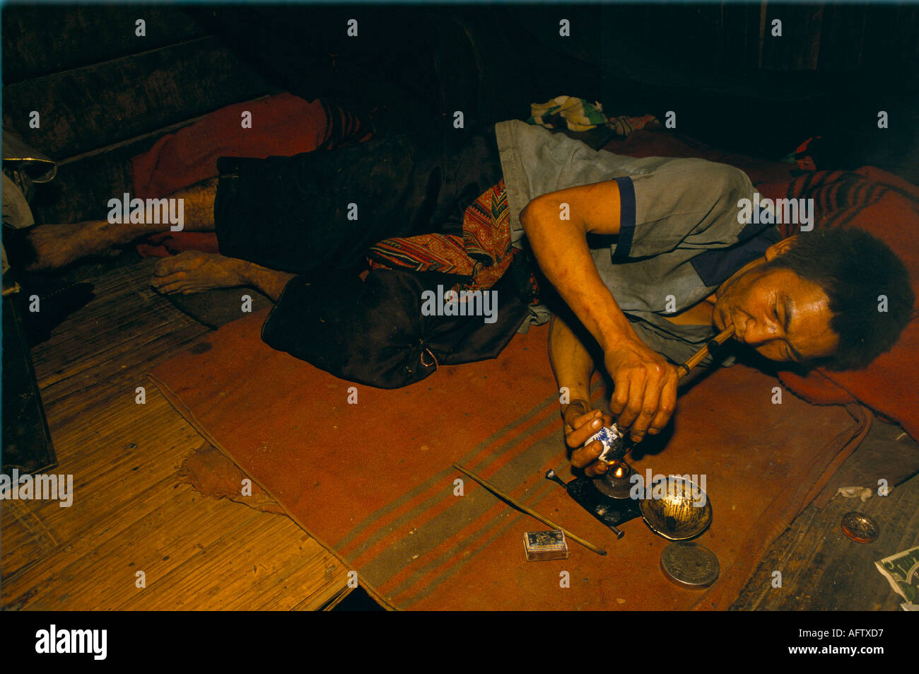 Opium addict, Drug addiction tribesman Northern Thailand. South East Asia Chiang Rai province, 1990s 90s HOMER SYKES Stock Photo