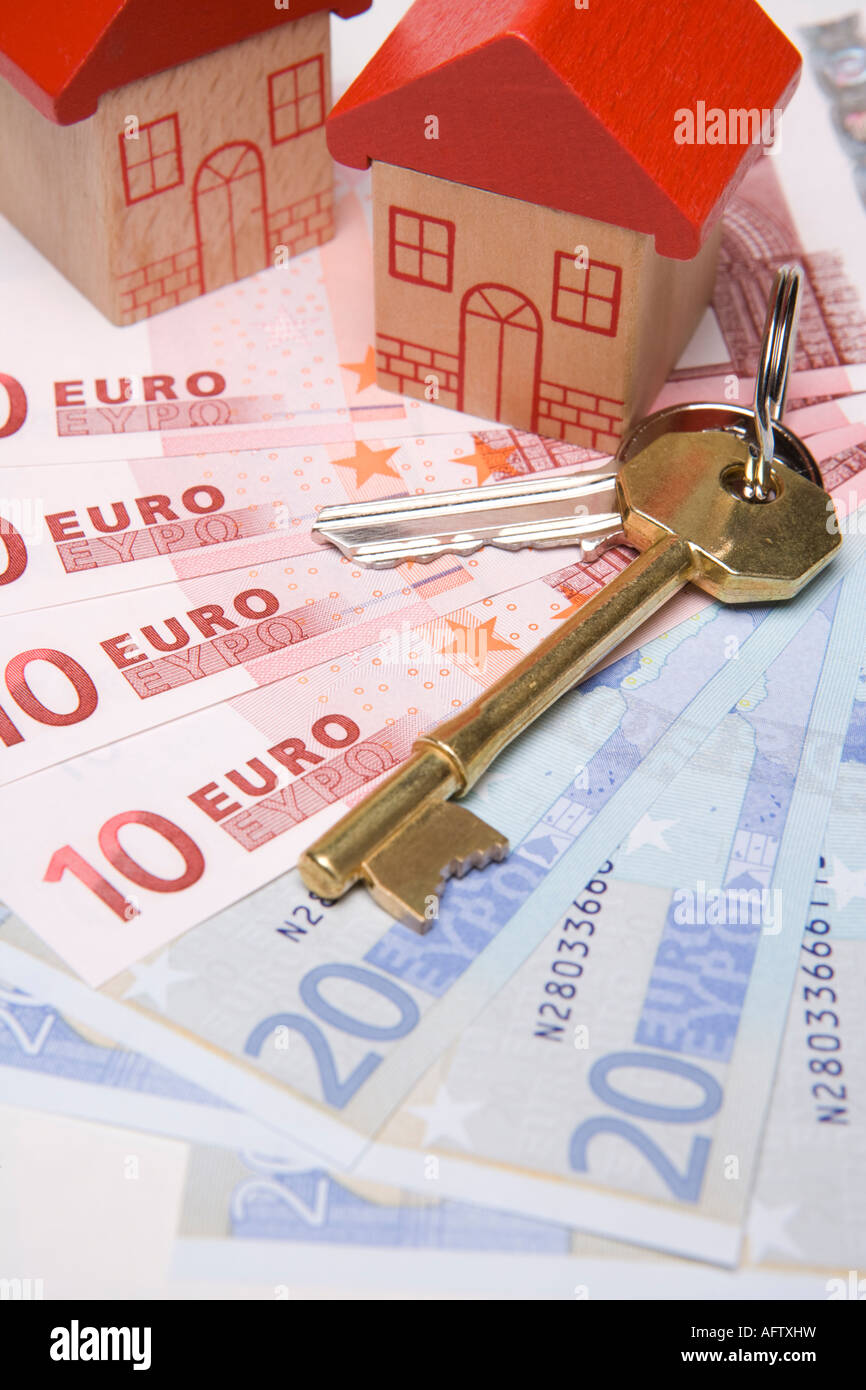 Keys to new houses Buying or investing in property or housing overseas or abroad with euros Stock Photo