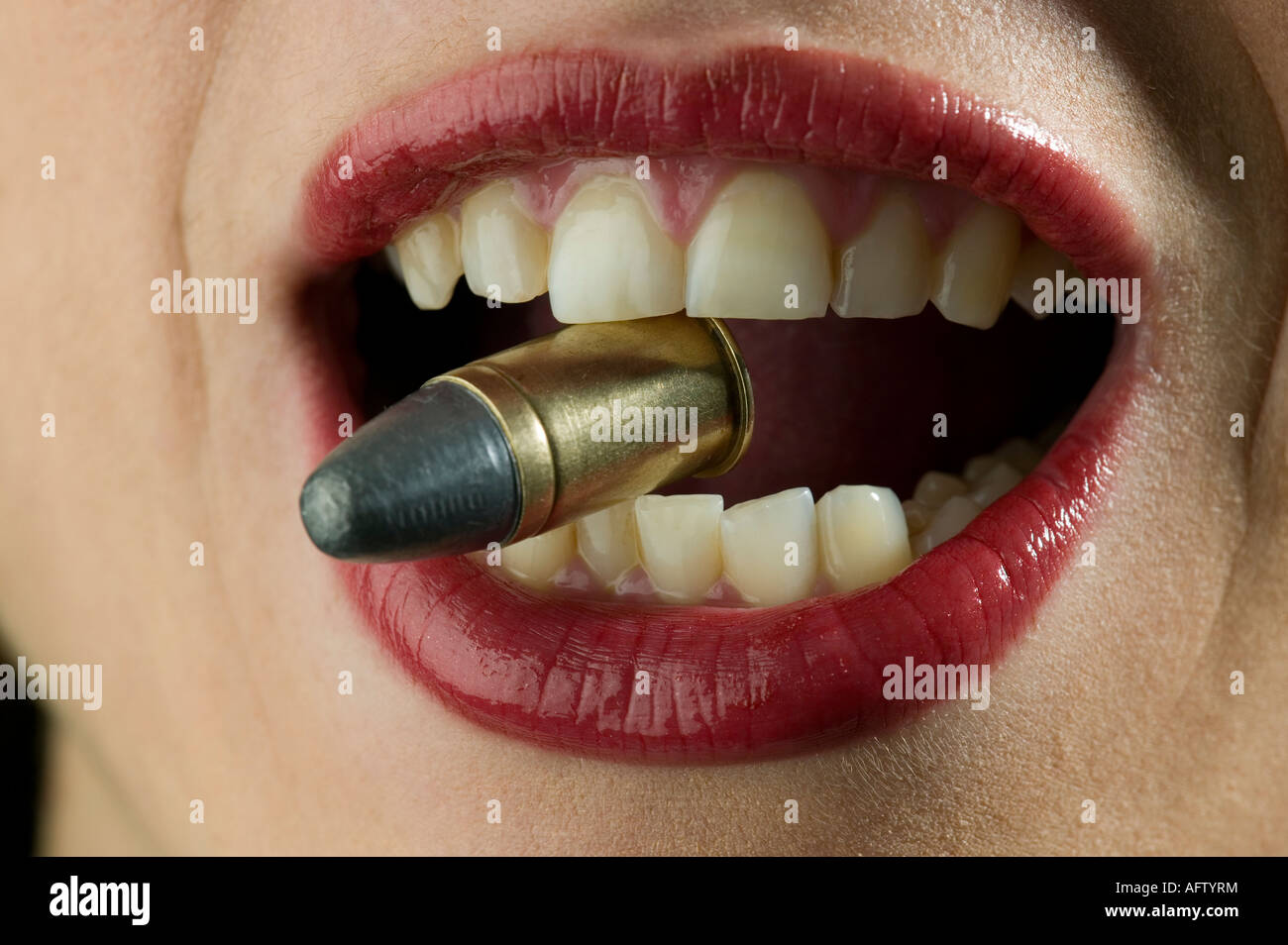 Biting the bullet hires stock photography and images Alamy