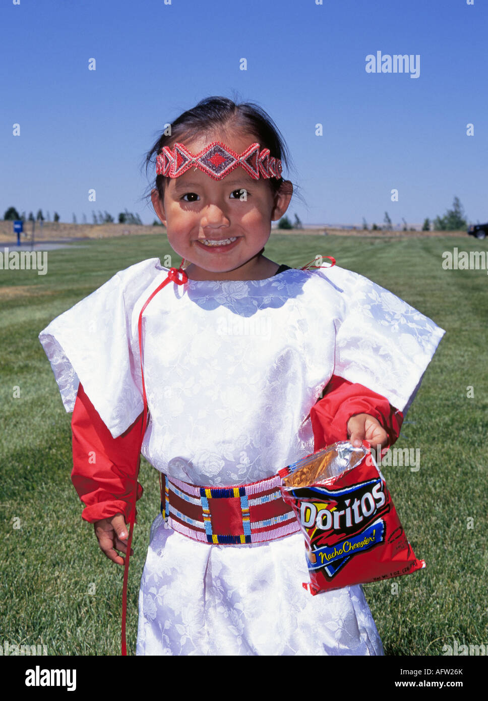 Portrait of a young Indian boy native american with a bag of Dortios tortilla chips, Pendleton, Oregon. Stock Photo