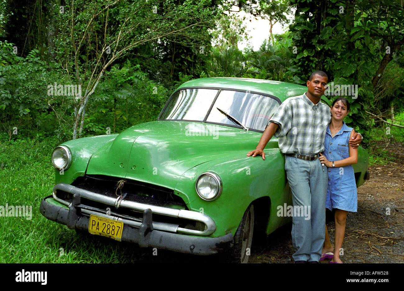 Cuban couple and their car Stock Photo Alamy