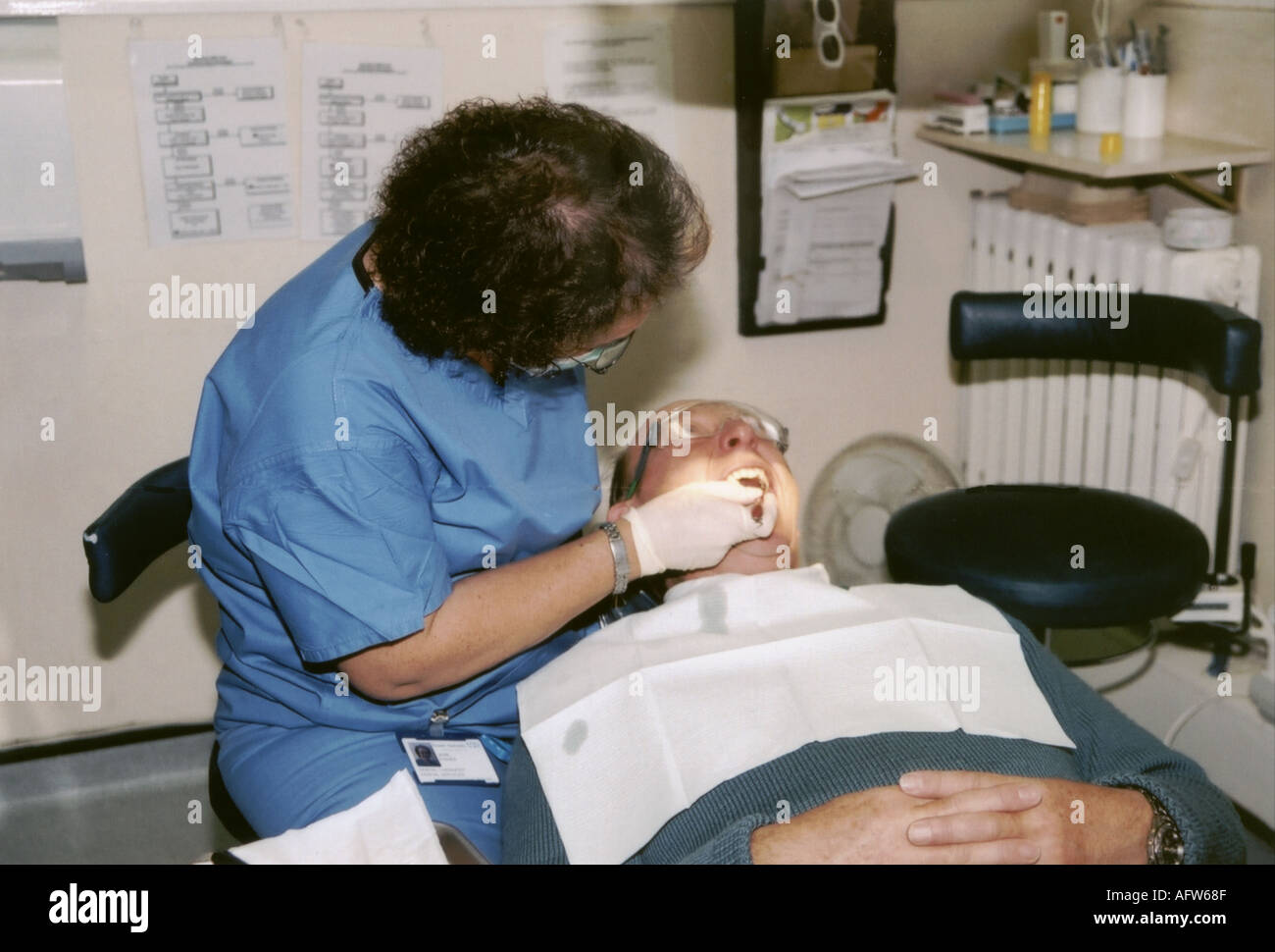 Dentistry dentist and patient Drilling inspection Stock Photo