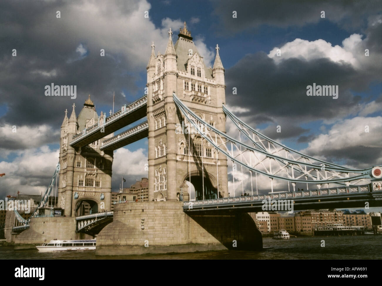 Pleasure craft under Tower bridge London England UK Great Britain Stock ...