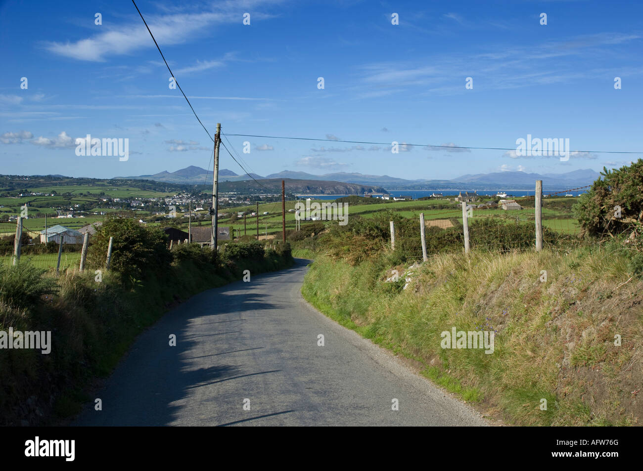 Looking towards Abersoch village Lleyn peninsula north wales down a quiet country lane on hot summer afternoon Stock Photo