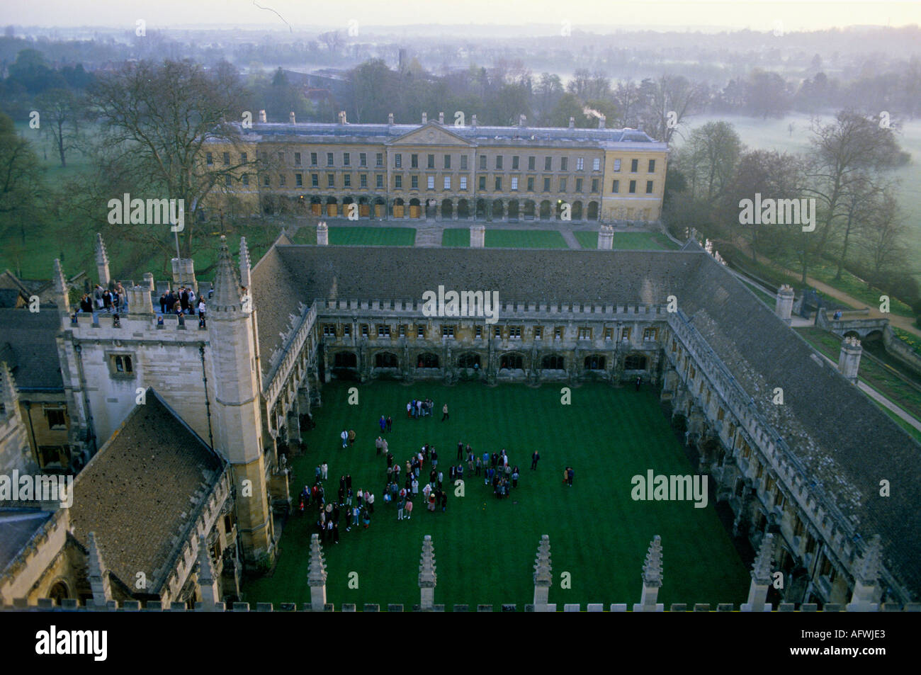 Oxford university Magdalen college students in quad at dawn on May Day 1990s UK Choir is singing from the top of the Great Tower. 1997 HOMER SYKES Stock Photo