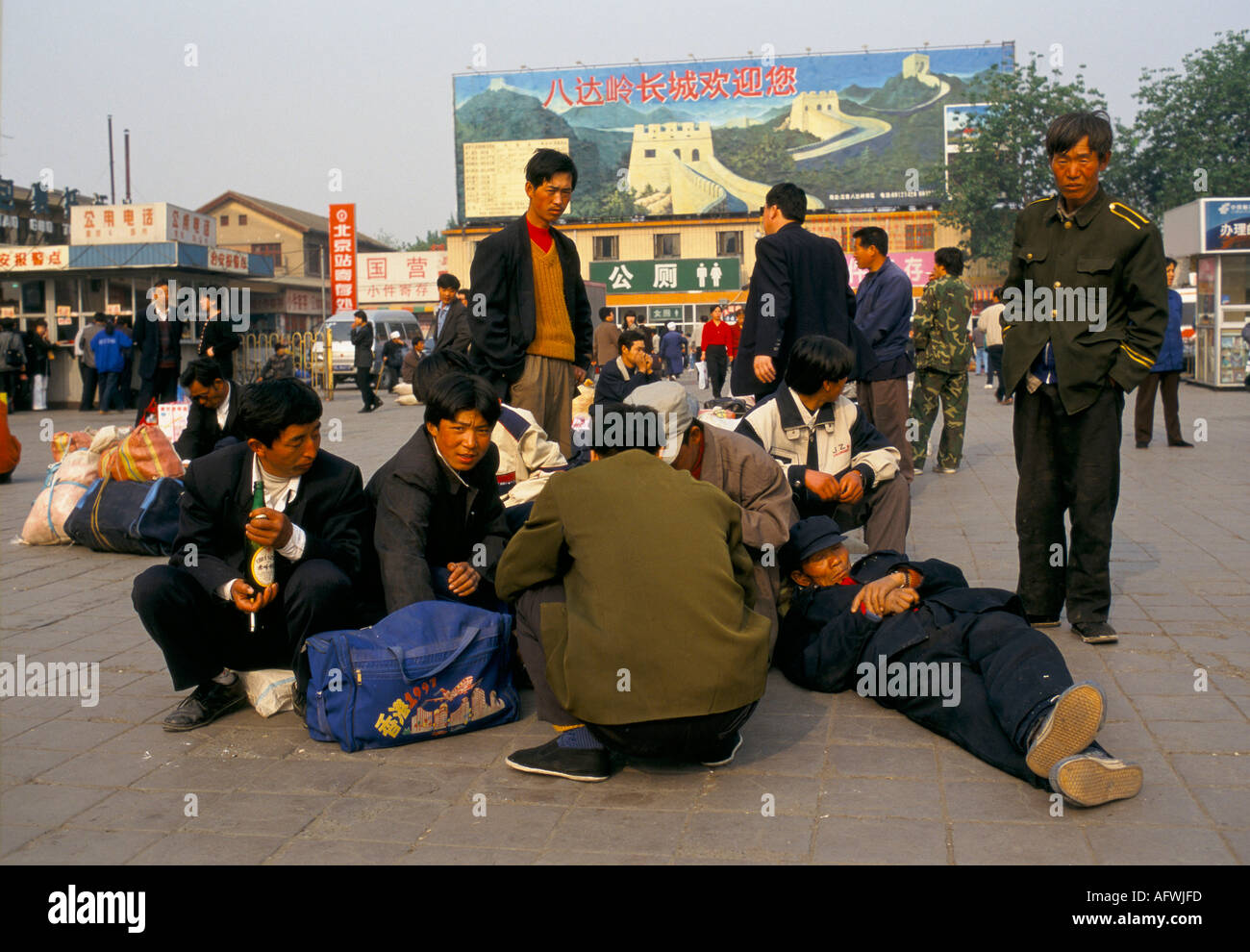 China 1990s .Migrant labour force workers wait for their  trains back to their towns in the country Beijing 1998 HOMER SYKES Stock Photo