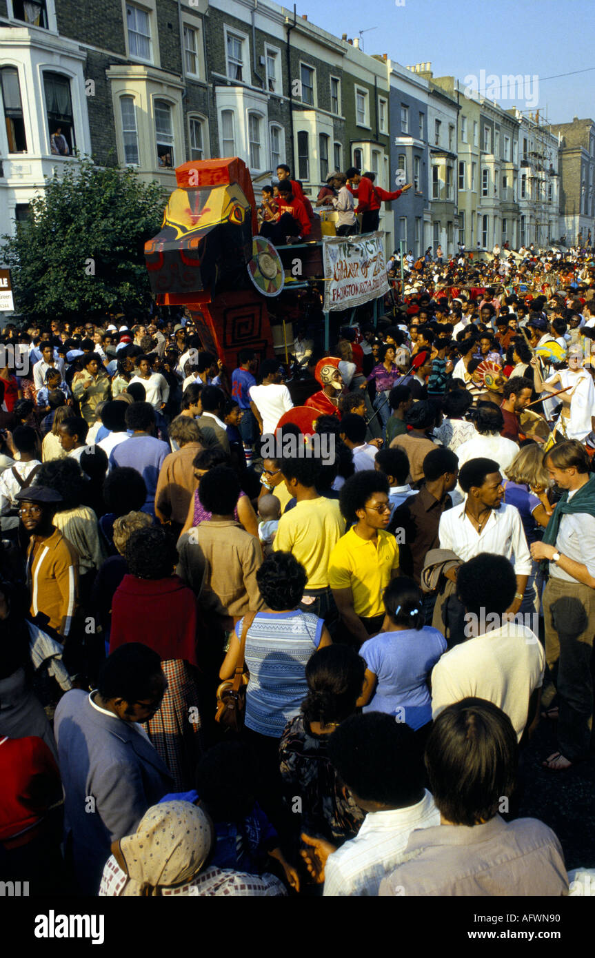 BUSY STREET SCENE AT NOTTING HILL GATE CARNIVAL FLOAT ON STREET PARADE