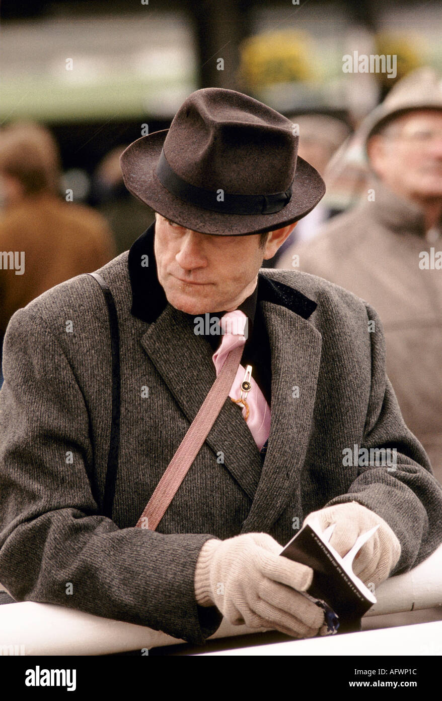 Dandy UK.  A man wearing brown tweed coat brown fedora hat, pink tie.  Cheltenham Festival horse racing 1990s  circa 1995 UK HOMER SYKES Stock Photo