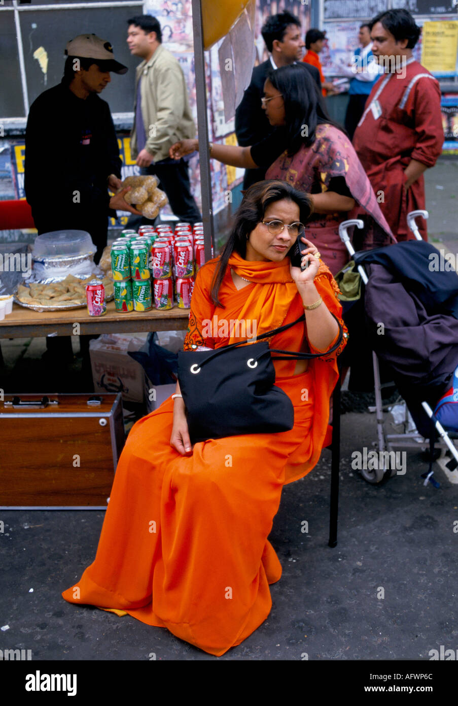 Bangladeshi community Brick Lane, east London woman wearing sari talking on mobile phone 1990s 1999 UK HOMER SYKES Stock Photo