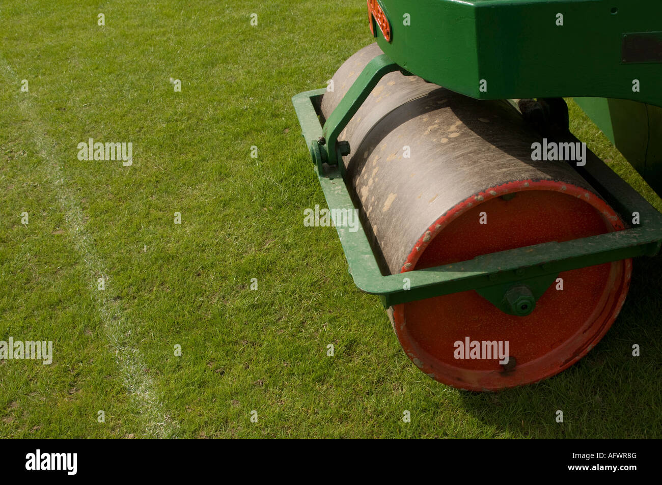 Heavy steel roller , tube shaped, for flattening cricket pitch Stock Photo