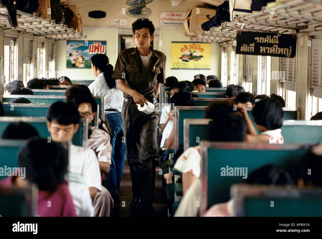 Train journey Thailand South East Asia 1990s ticket collector. 1991 HOMER SYKES Stock Photo