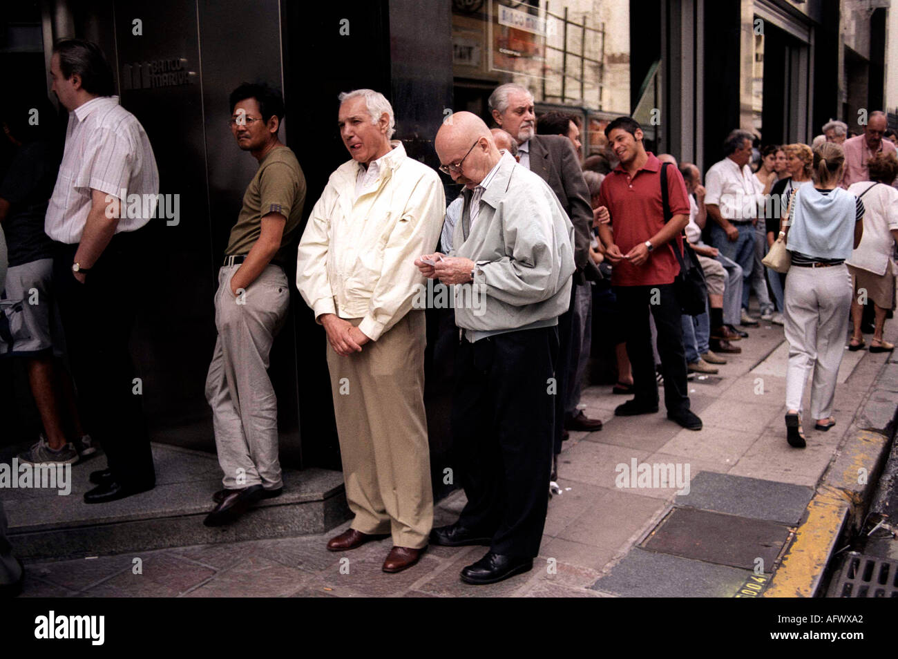 Argentina Inflation 2000s. Economic Crisis in Buenos Aires South America 2002. People queueing to withdraw money, run on the bank.   2000s Stock Photo