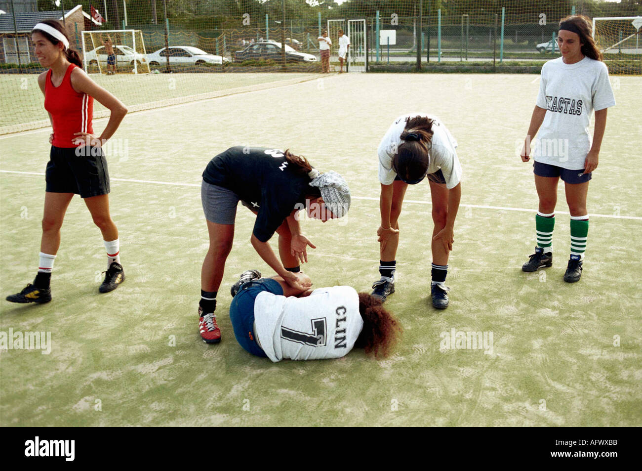 Argentina women playing football 2002, The Exactas soccer all womens five a side team practice team player hurt. Buenos Aires 2000s HOMER SYKES Stock Photo