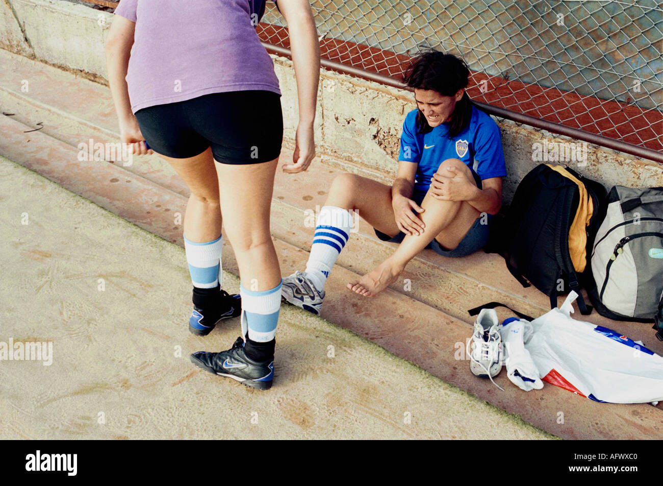 Argentina women playing football 2002, The Exactas soccer all womens team practice in suburban Buenos Aires 2000s Player hurt HOMER SYKES Stock Photo