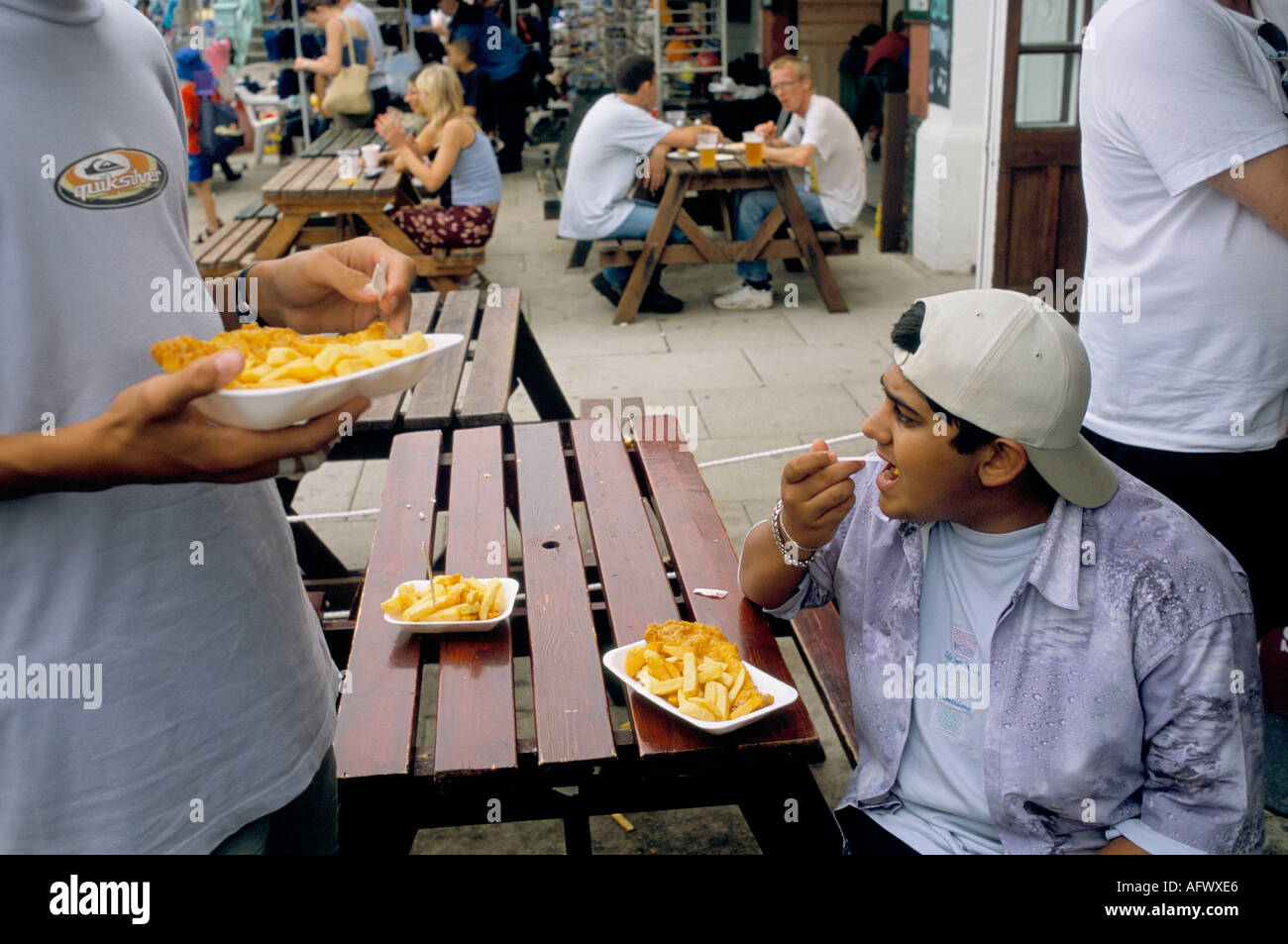 A plate of fish and chips. Fast junk food Brighton, Sussex England. circa 1995 1990s UK HOMER SYKES Stock Photo