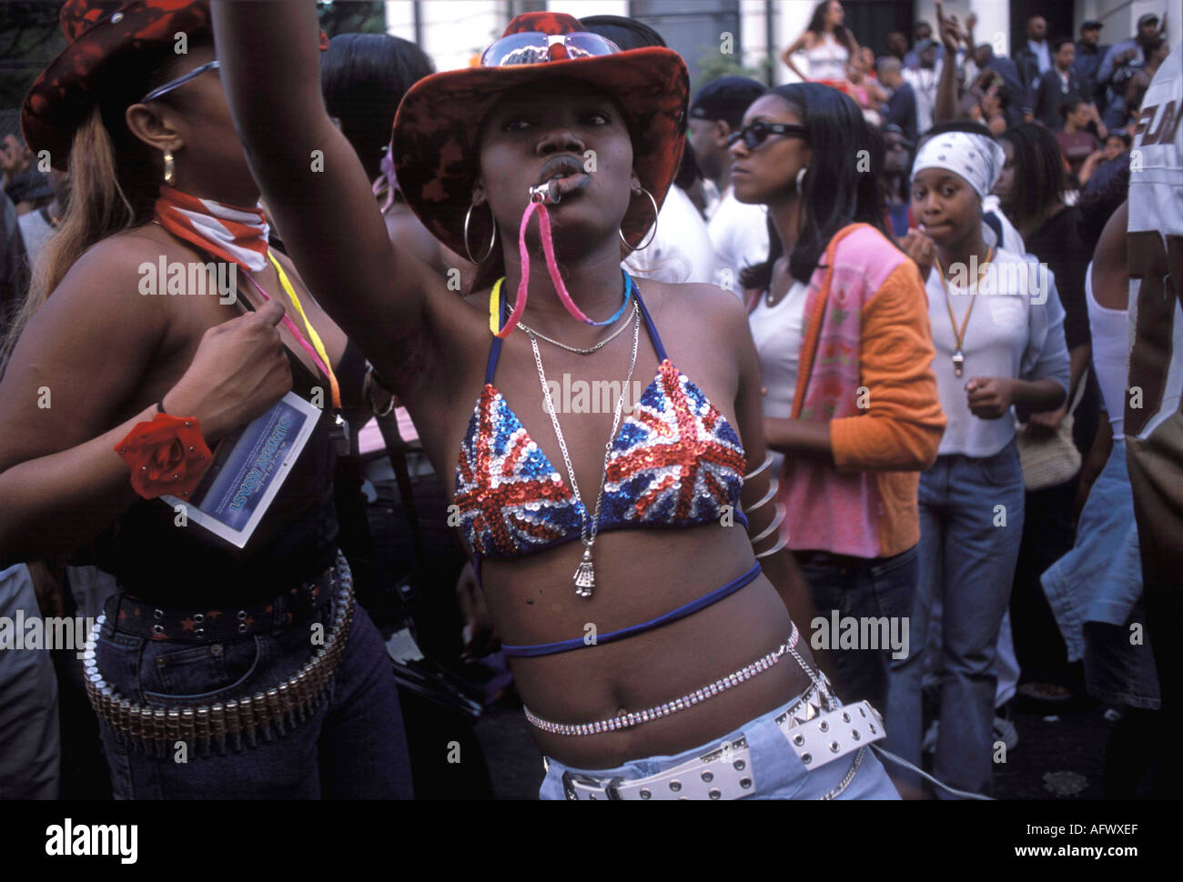 Black British 1990s teen teenager girl wearing Union Jack clothing bikini bra top at the Notting Hill carnival London UK Teenage Identity HOMER SYKES Stock Photo