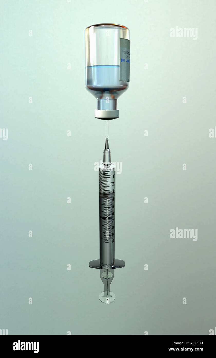 A syringe drawing medicine from a bottle. Stock Photo