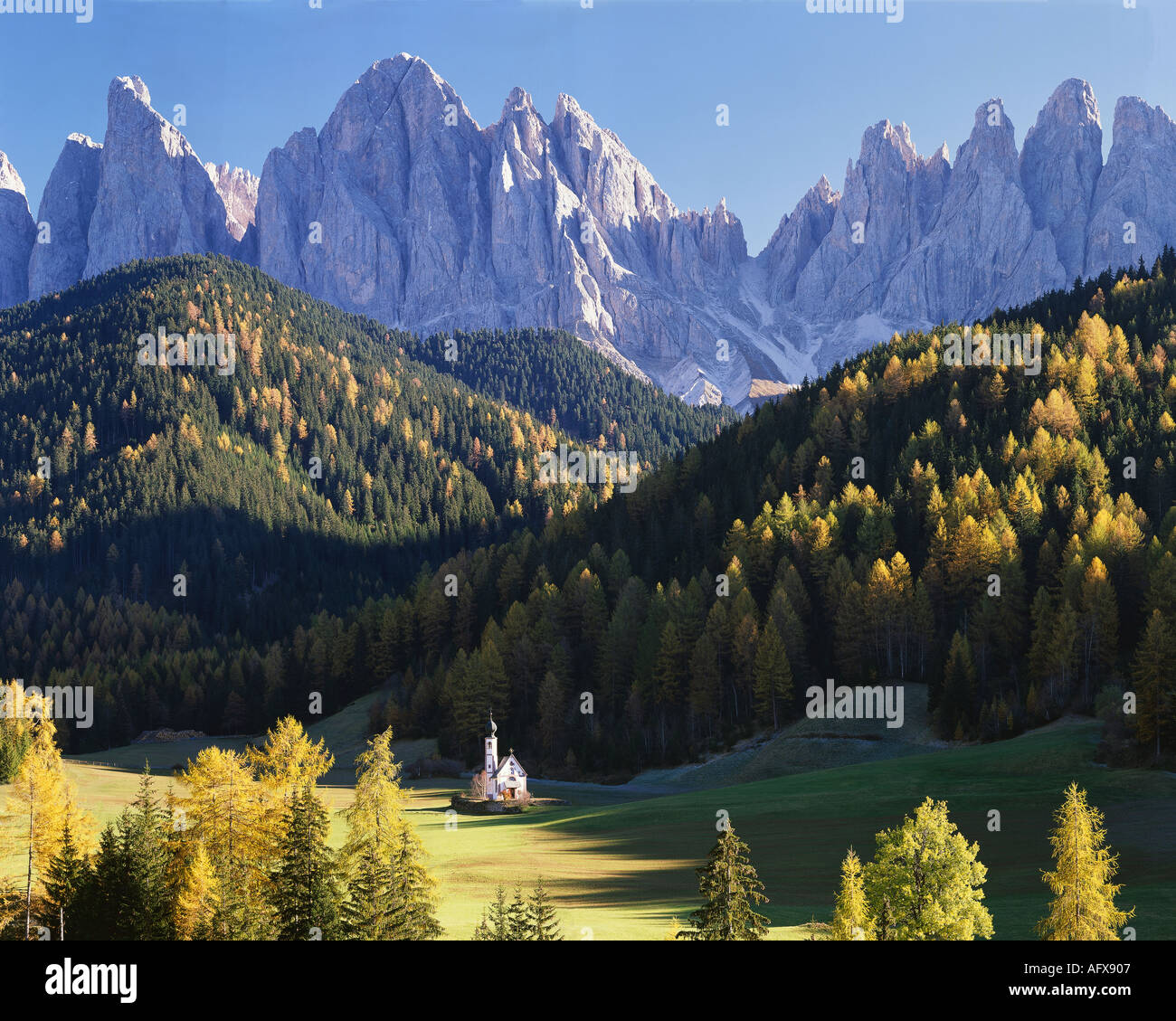 IT - DOLOMITES: St Johann in Ranui and Geisler Spitzen Mountains Stock Photo