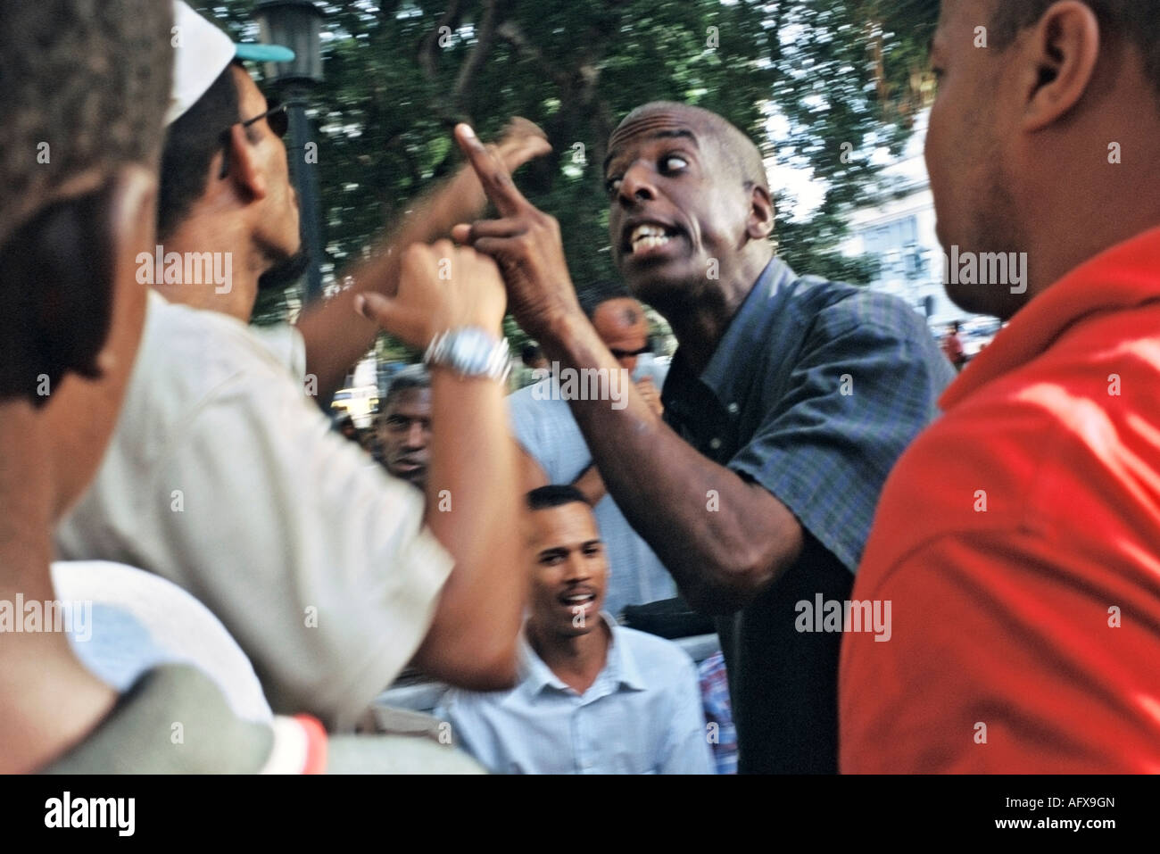 A scene in Havana Cuba s Parque Central where men gather daily to have animated discussions about baseball Stock Photo