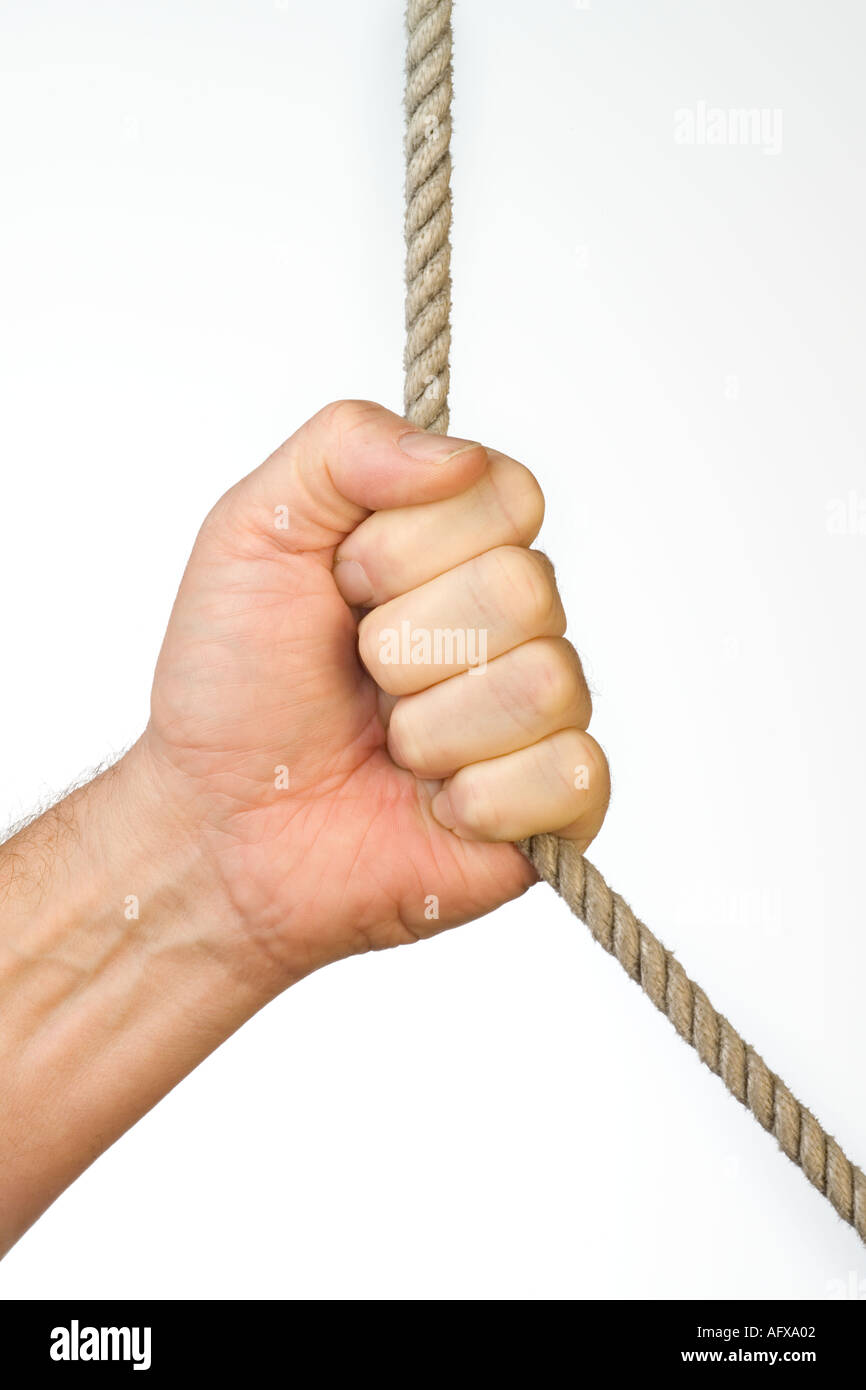 Male hand pulling rope Stock Photo - Alamy