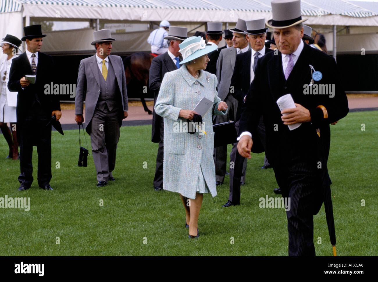Queen Elizabeth II at the Derby Day  Epsom Downs Race Course Surrey UK  1995. In foreground Lord Porchester Earl Carnarvon 1990s HOMER SYKES Stock Photo