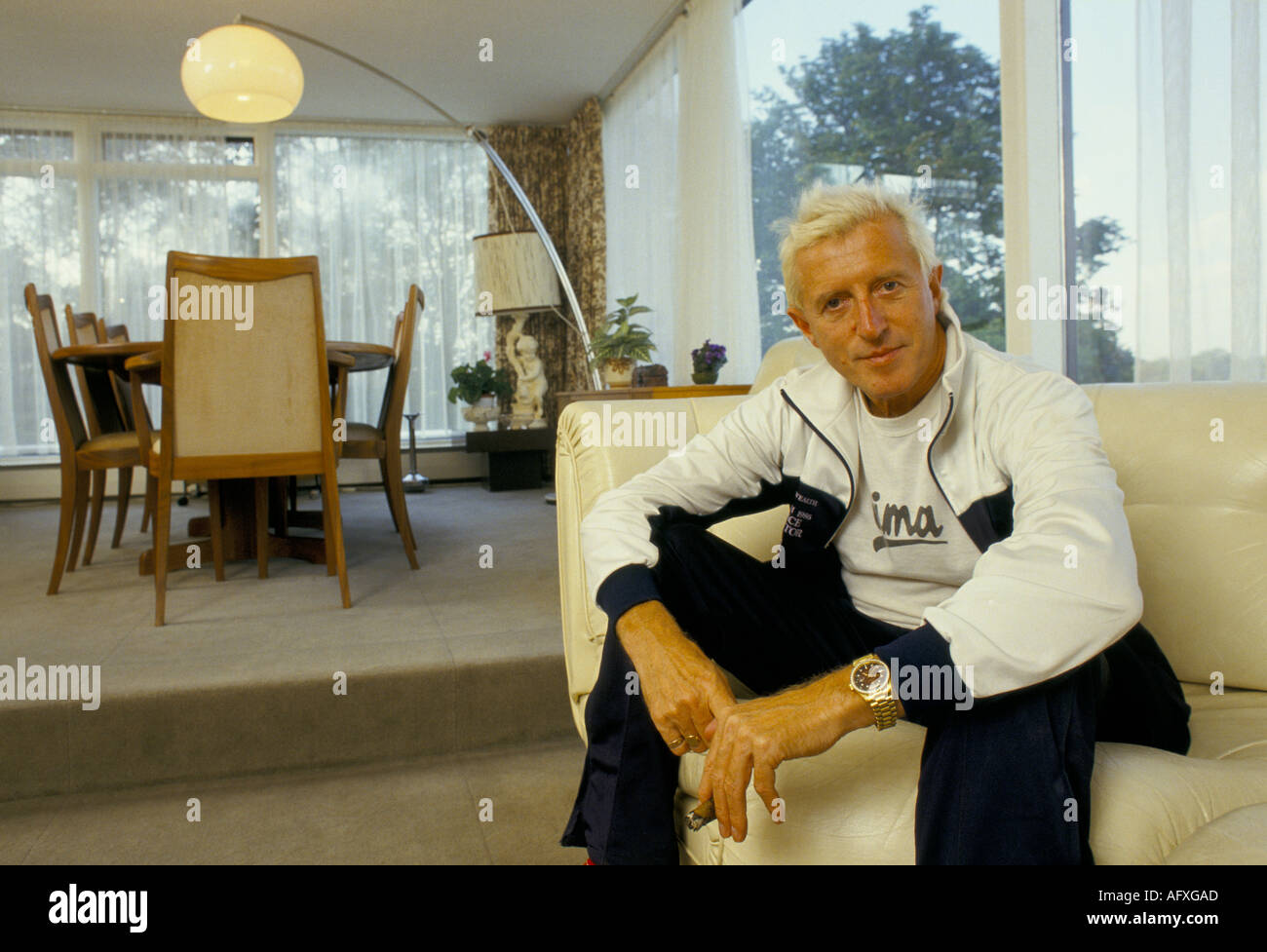 Jimmy Savile British entertainer disc jockey TV radio broadcaster seen his flat overlooking Roundhay Park. Leeds England UK Late1980s or early 1990s. Stock Photo