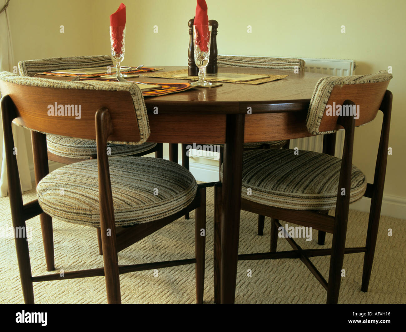 STUDIO STILL LIFE Image of a Dining room table laid for two people to dine but chairs are unoccupied Stock Photo