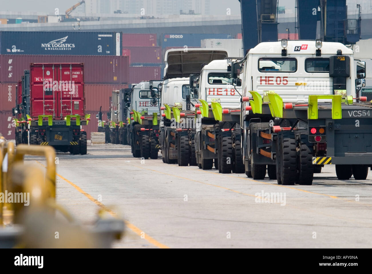 Container Shipping trucks line up to receive unloaded containers at ...