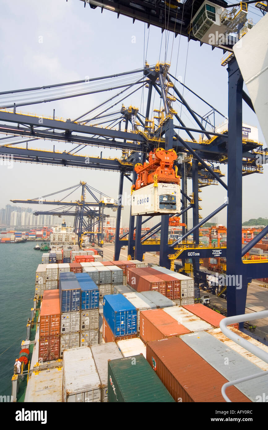 Container shipping heavy lift overhead cranes unloading containers from ...