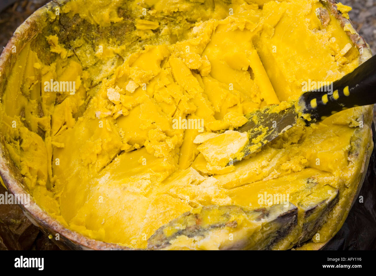 Shea butter from Ghana in bowl made from African Karite Shea tree Stock