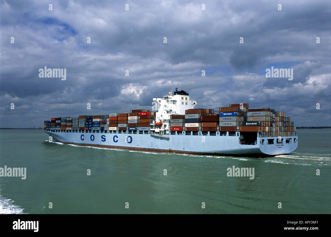 Container ship 'Cosco China' entering the Port of Felixstowe in Suffolk, Britain's largest container port. Stock Photo