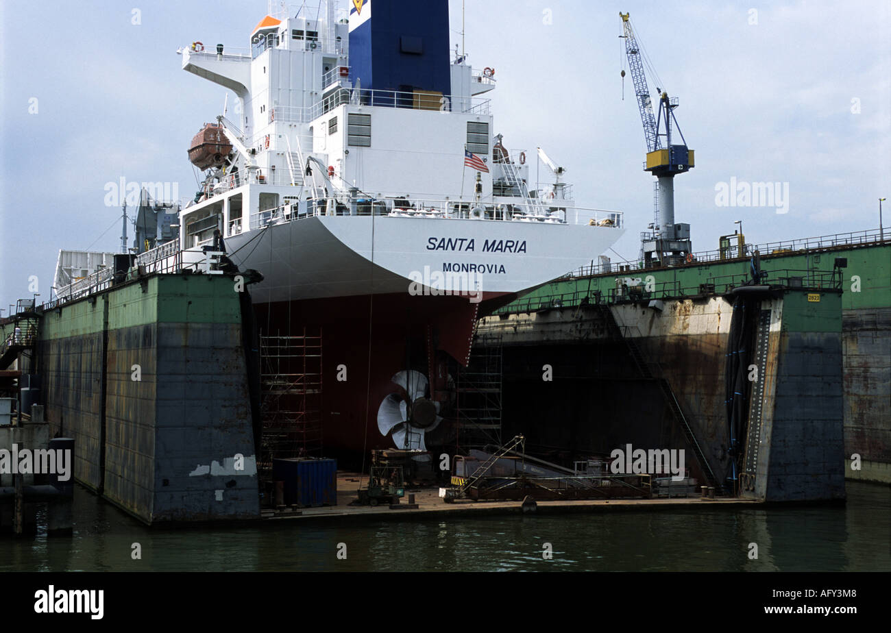 Ship under repair in a floating drydock at the Port of Rotterdam, Netherlands. Stock Photo