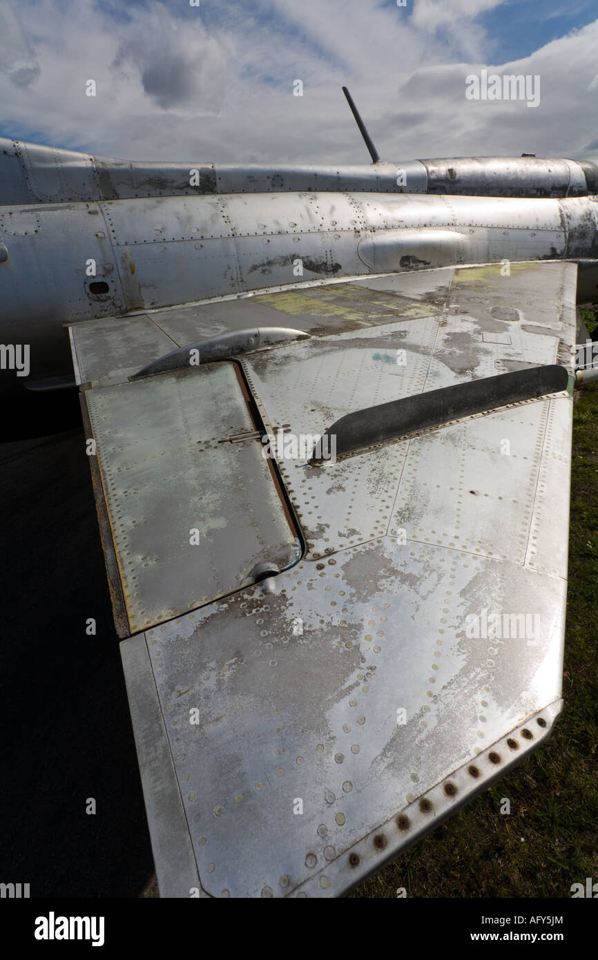 MiG-21 retired aircraft, wing with prominent aileron and fence is extremely weathered and in patchy condition Stock Photo