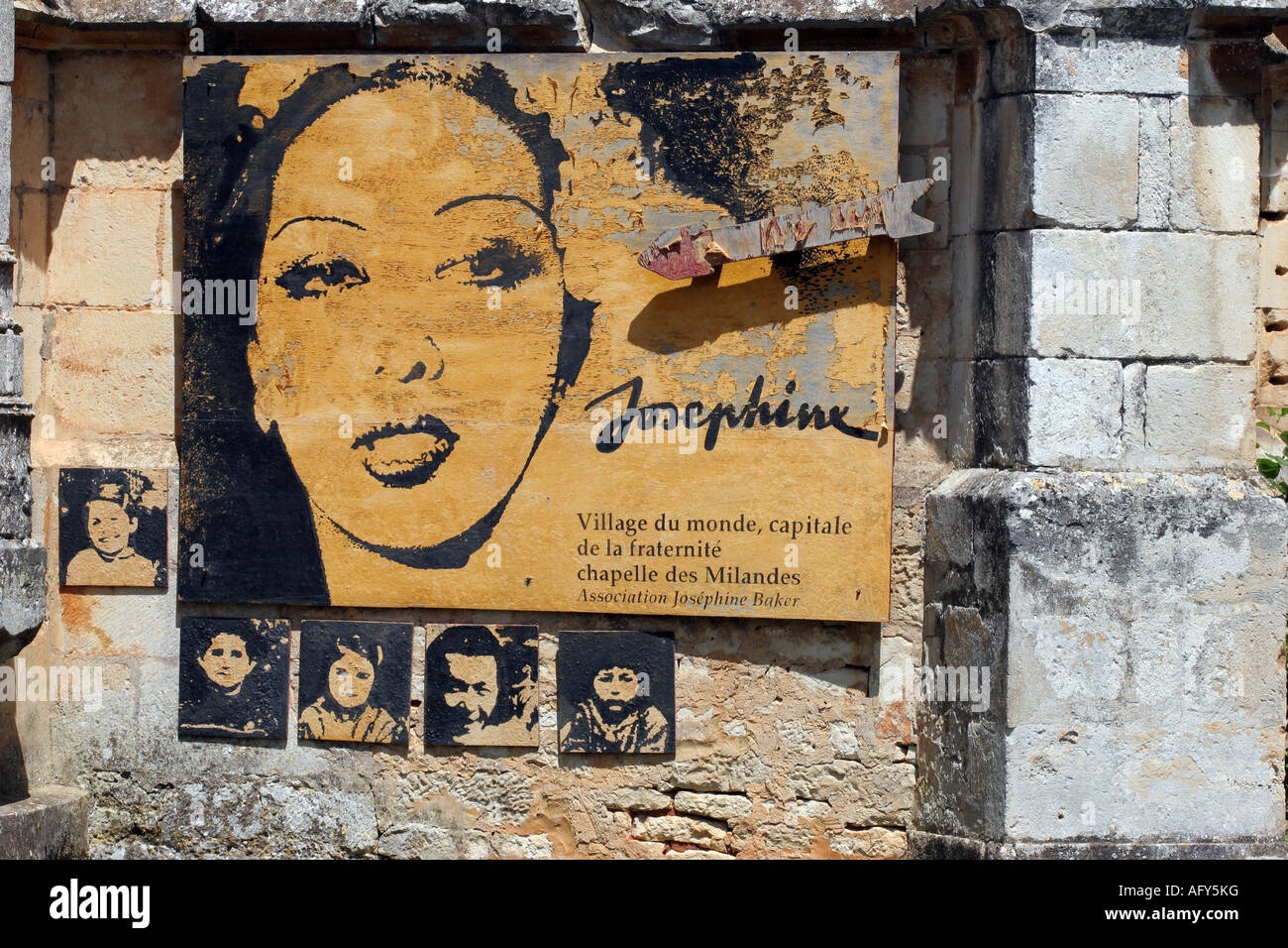 Peeling and Weathered Portrait of Josephine Baker on the Wall of the Château des Milandes Dordogne Valley France. Stock Photo