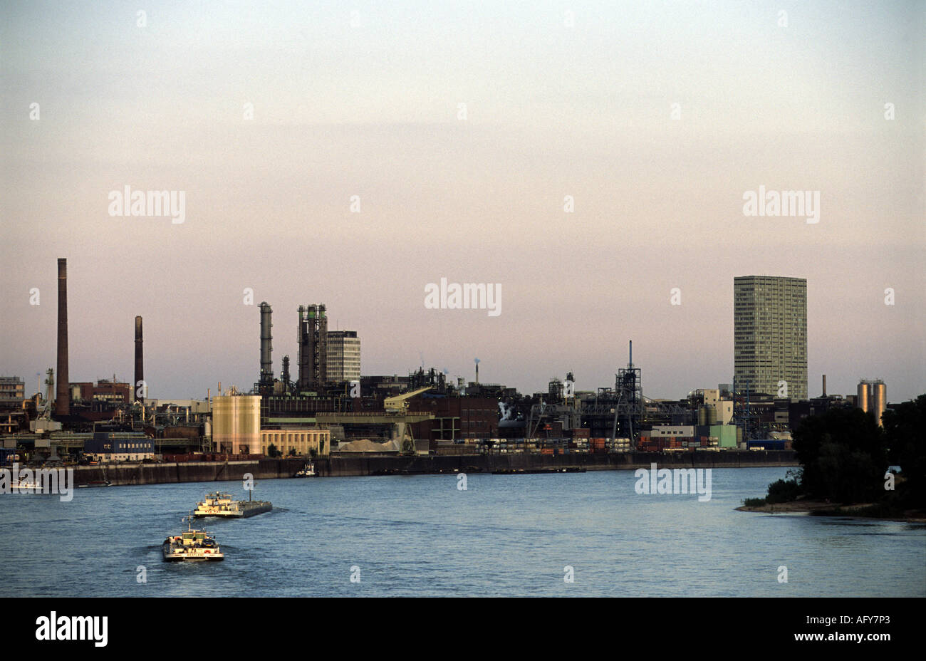 Commercial barges on the river Rhine in Leverkusen, North Rhine