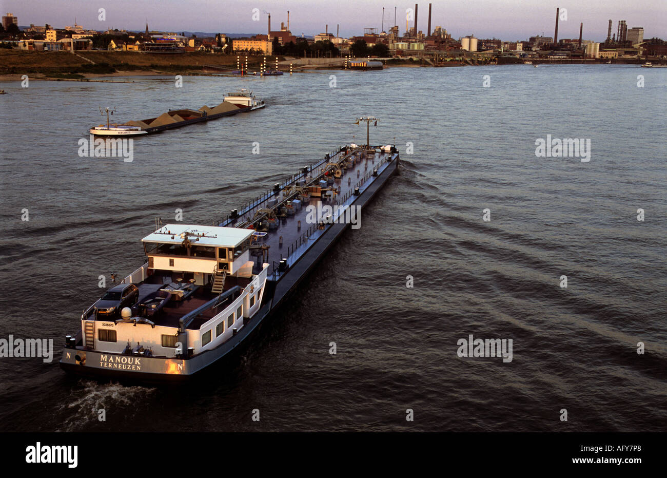 Commercial barges on the river Rhine, Leverkusen, North Rhine Westphalia, Germany. Stock Photo