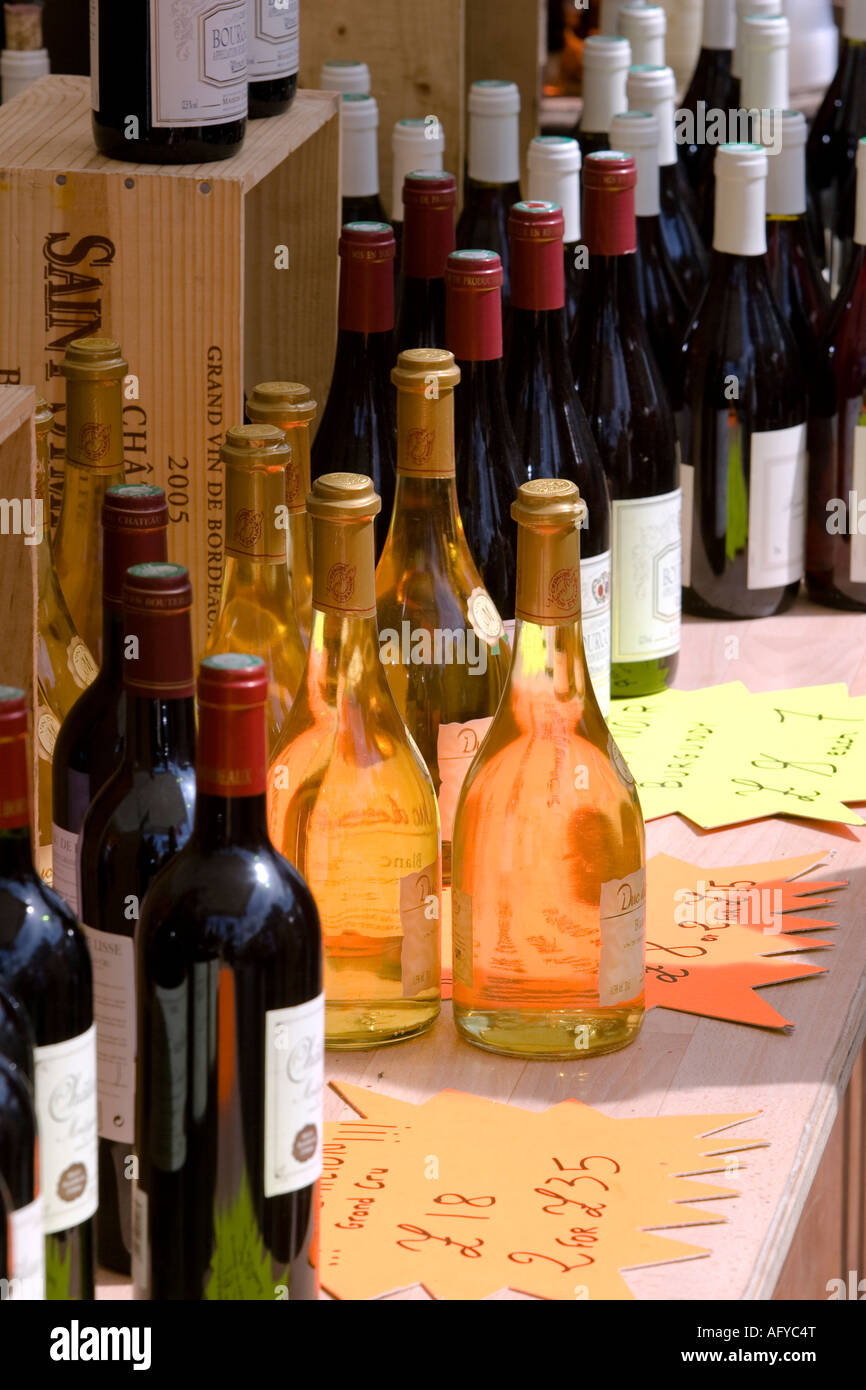 Rows of bottles of French wine for sale on stall during open air French