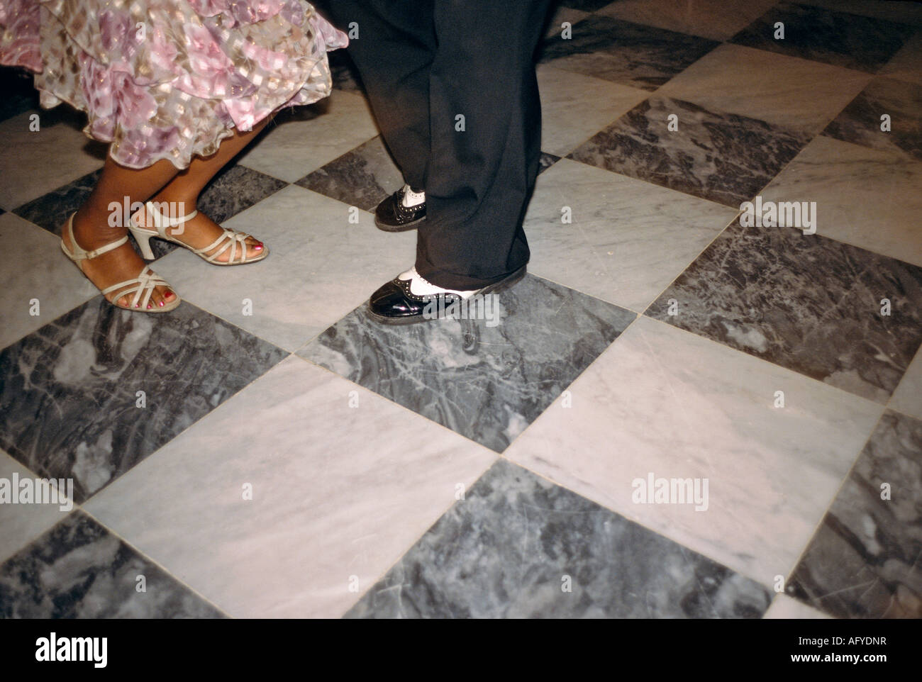Feet and legs of a Cuban couple dancing salsa to a band in the lounge of the Hotel La Florida in Habana Vieja Old Havana Stock Photo