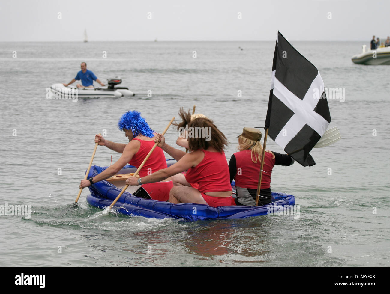 Charlestown regatta Cornwall raft race baywatch babes in drag Stock