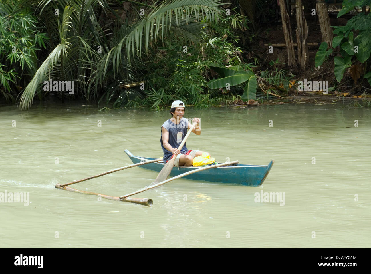 Philippines Filipino Man Paddling Canoe Down Loboc River Bohol Visayas Stock Photo Alamy